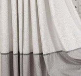 Loose-fitting gray and white streetwear garment with soft fabric and color block design