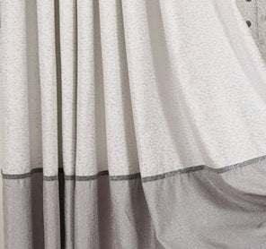 Loose-fitting gray and white streetwear garment with soft fabric and color block design