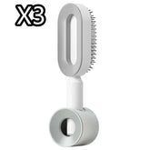 Modern white pet grooming brush with ergonomic handle and fine bristles, set of three.