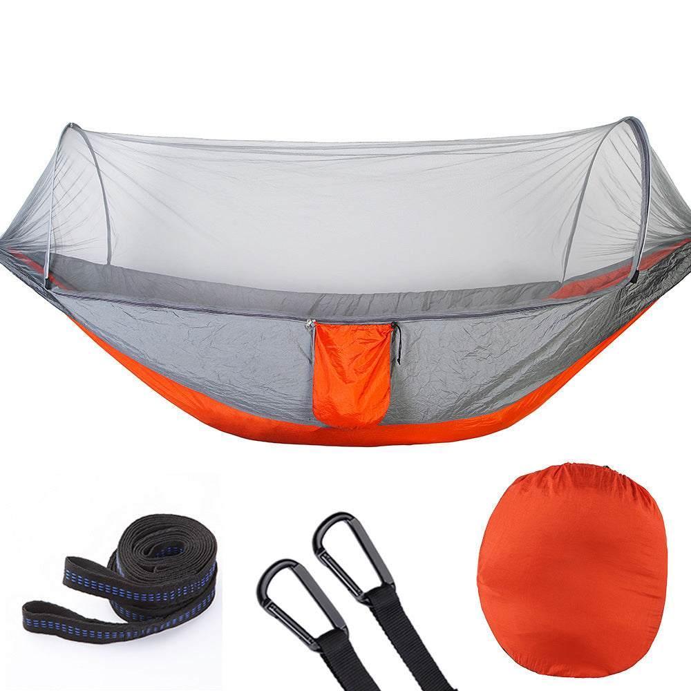 Lightweight orange and gray camping hammock with mosquito net, straps, and storage bag