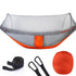 Lightweight orange and gray camping hammock with mosquito net, straps, and storage bag