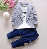 Kids’ outfit with plaid gray blazer, white printed tee, and navy blue jogger pants, casual fit