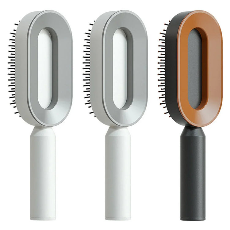 Modern oval hair brushes in white, grey, and orange with ergonomic handles and sleek design