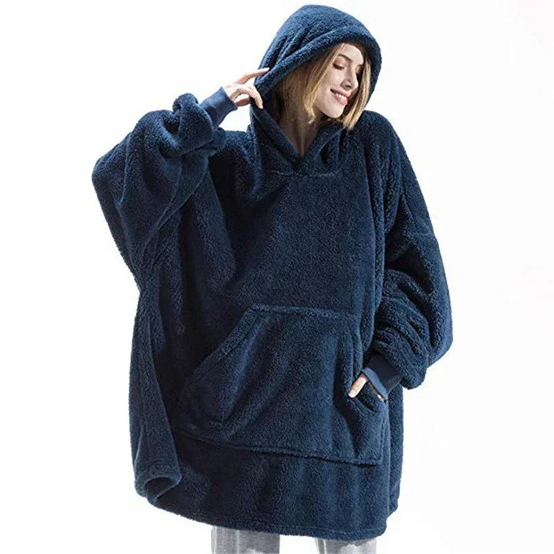 Woman wearing oversized navy blue fleece hoodie with kangaroo pocket and relaxed fit