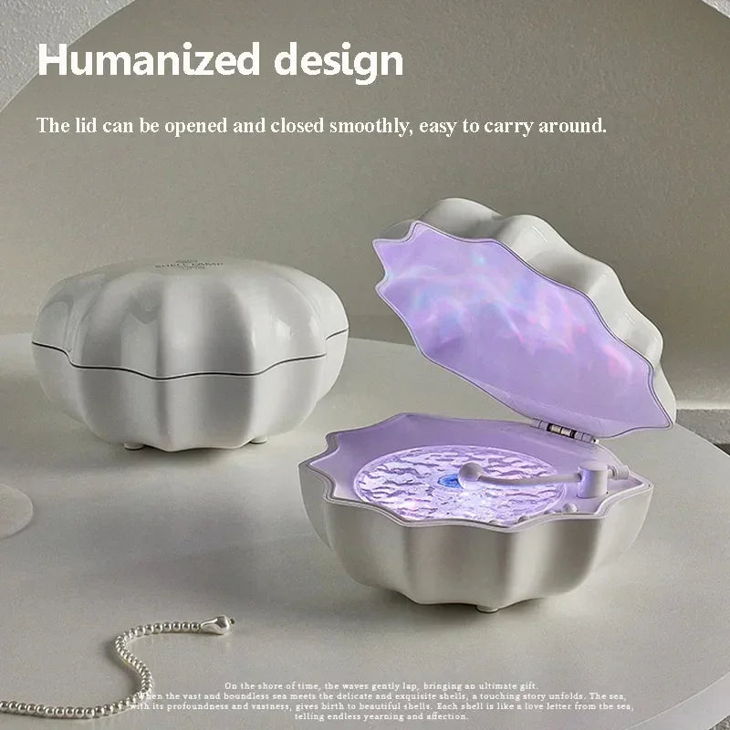 White clamshell-shaped jewelry box with iridescent interior on neutral tabletop.