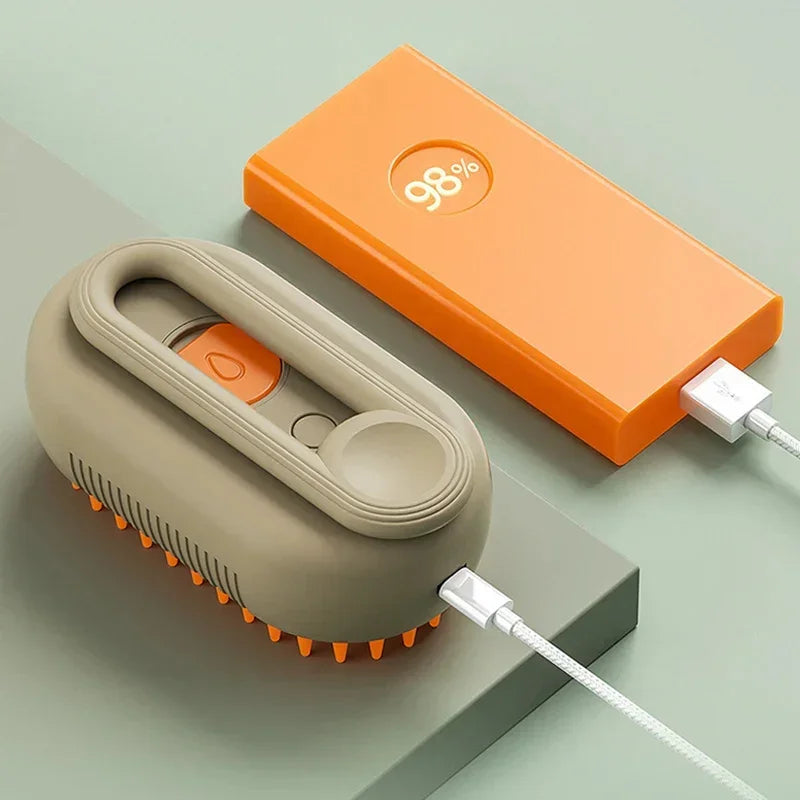 Modern tech scalp massager in beige with orange silicone bristles, charging beside orange power bank