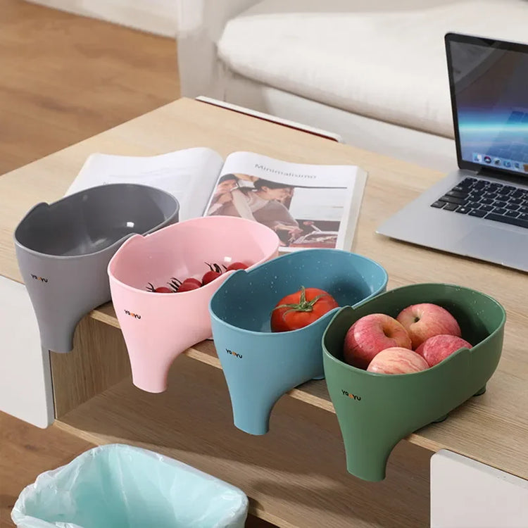 Colorful plastic snack or fruit bowls clipped to table edge, assorted fruits inside, modern home decor