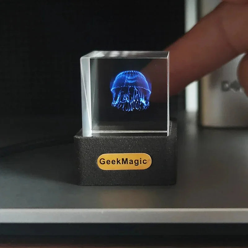 Holographic jellyfish cube light with black base and glowing blue display