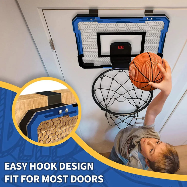 Kid in grey short sleeve shirt playing indoor basketball, blue backboard, relaxed fit.