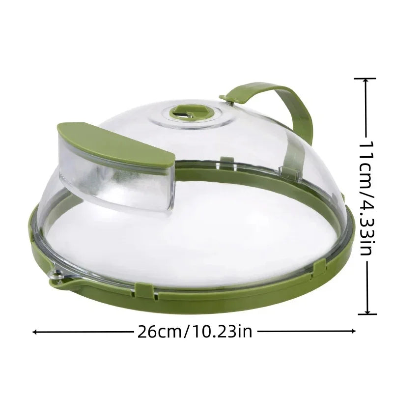 Clear plastic food cover with green trim, handle, and air vent, measuring 26cm by 11cm