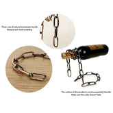 Metal chain wine bottle holder with bronze finish, unique floating display, modern decor.