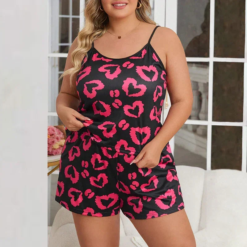 Plus size satin sleepwear set with pink heart leopard print, black cami top and shorts