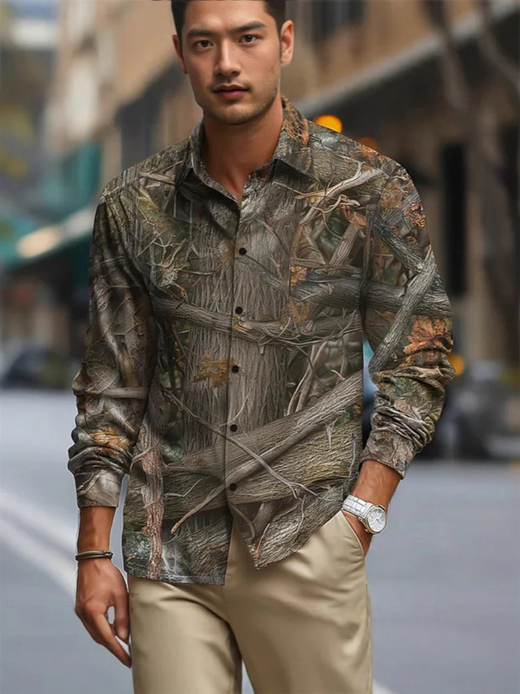Man wearing a slim-fit, long-sleeve button-up shirt with a brown and green camouflage nature print.