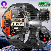 Rugged silver smart watch with black silicone band, large digital display, multifunctional fitness tracking, and built-in flashlight.