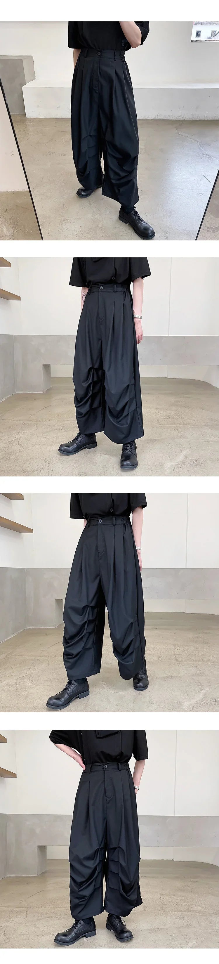 Loose fit black wide-leg pleated trousers in lightweight material, streetwear style