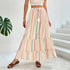Woman wearing a flowy cream maxi skirt with colorful vertical chevron stripes, relaxed fit