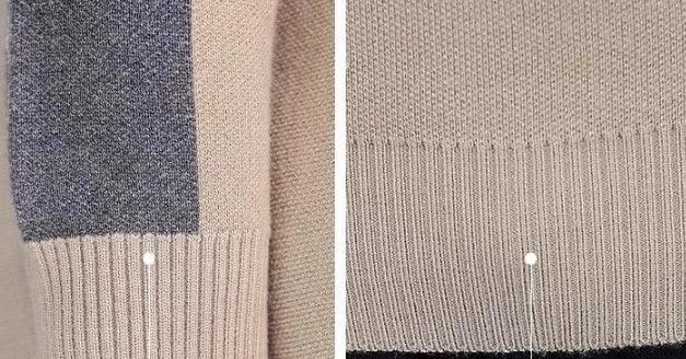 Close-up of beige knit sweater with ribbed cuffs and colorblock detail, soft texture