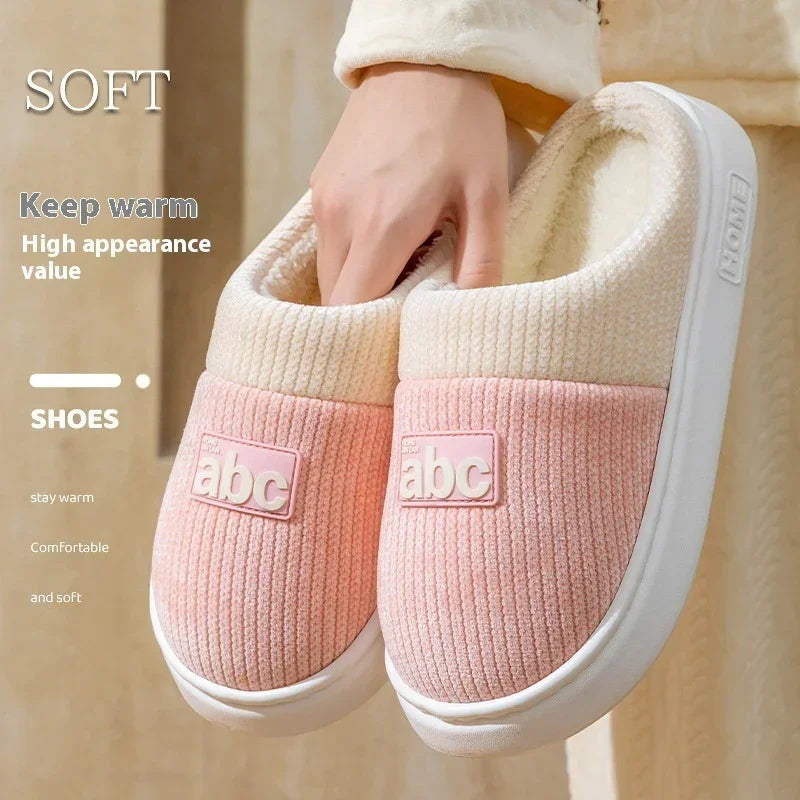 Cozy pink and cream slip-on slippers with soft textured fabric and plush lining