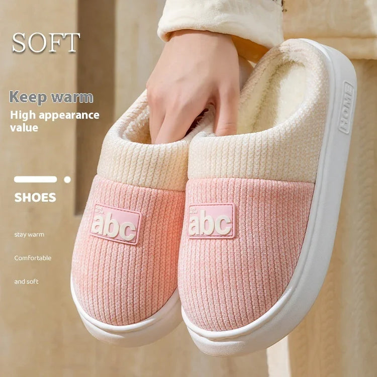 Cozy pink and cream slip-on slippers with soft textured fabric and plush lining