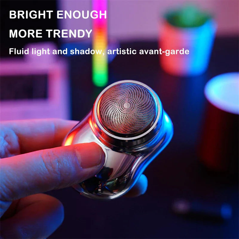 Hand holding a metallic, futuristic streetwear accessory with a textured top, reflecting colorful neon lights