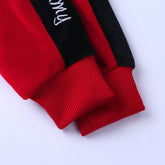 Red and black sweatshirt sleeves with ribbed cuffs, soft fleece material, relaxed fit