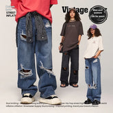 Unisex oversized ripped jeans in blue and black denim, distressed streetwear style, loose fit.
