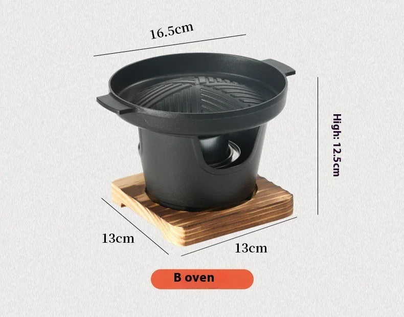 Black cast iron tabletop grill with grooved pan, wooden base, and size measurements displayed.