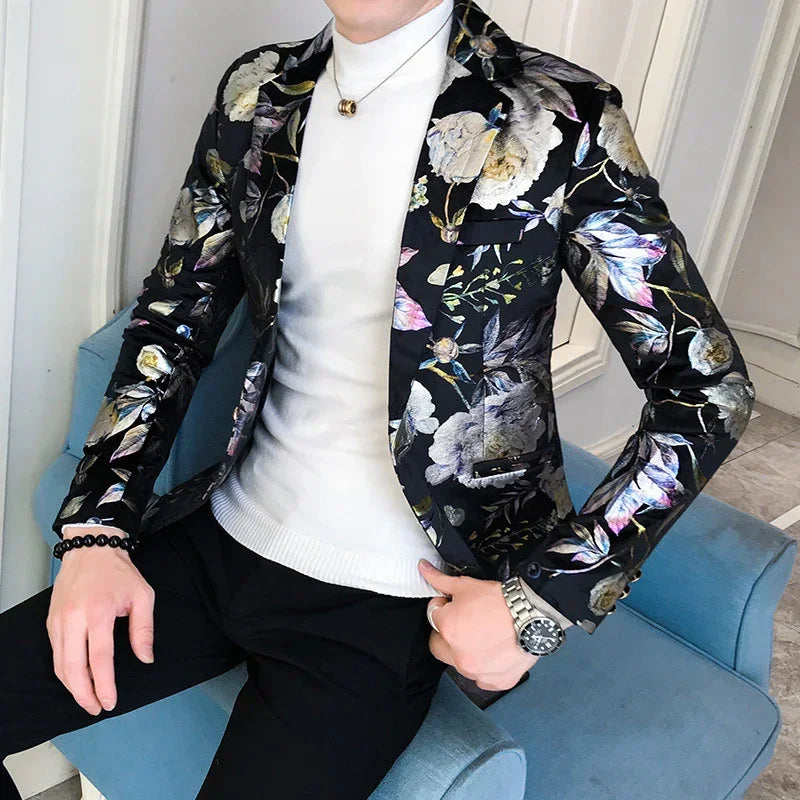 Men's slim fit floral blazer in black with metallic floral pattern, paired with white turtleneck.