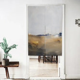Modern abstract fabric door curtain in beige, gray, and gold tones, hung in a minimalist living space.