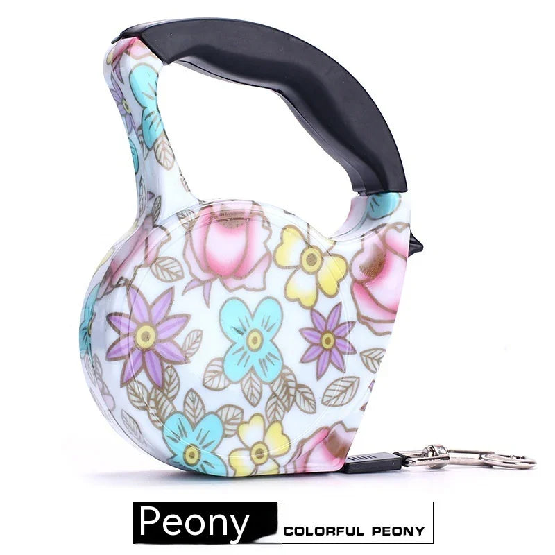 Retractable dog leash with pastel floral print and ergonomic black handle