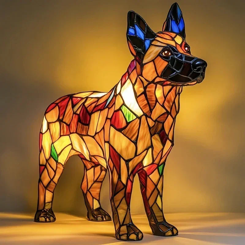 Stained glass dog lamp with multicolored geometric panels, illuminated on a plain background.