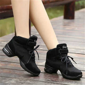 Black suede lace-up dance sneakers, mid-top style with cushioned soles, sporty fit
