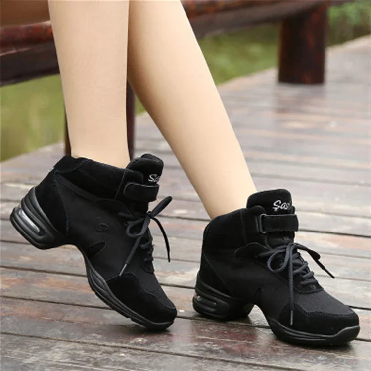 Black suede lace-up dance sneakers, mid-top style with cushioned soles, sporty fit