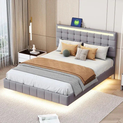 Modern gray upholstered platform bed with LED lighting and neutral bedding in a stylish bedroom