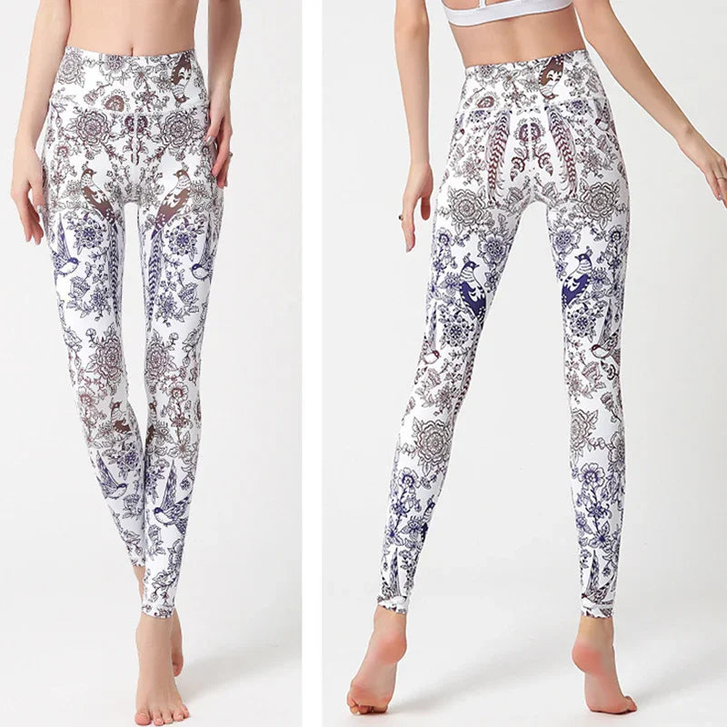 High-waisted white leggings with intricate blue and brown floral patterns, slim fit, stretch fabric