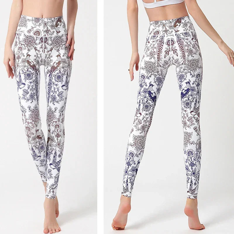 High-waisted white leggings with intricate blue and brown floral patterns, slim fit, stretch fabric