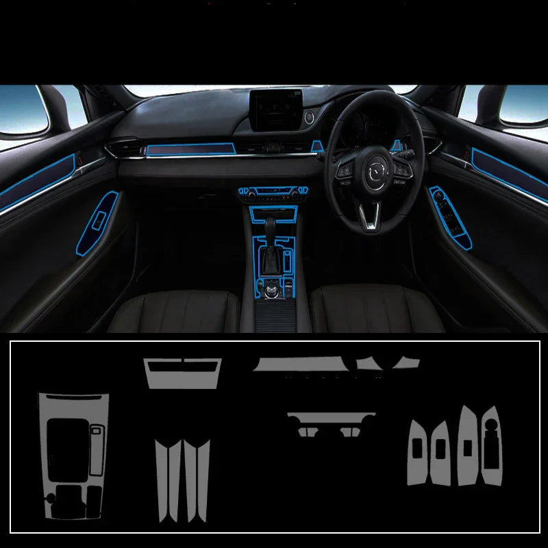 Car interior with black leather seats and dashboard accented by blue trim, showing a full interior trim kit layout below.