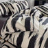Modern black and white brushstroke pattern bedding set with matching pillow covers, cotton material