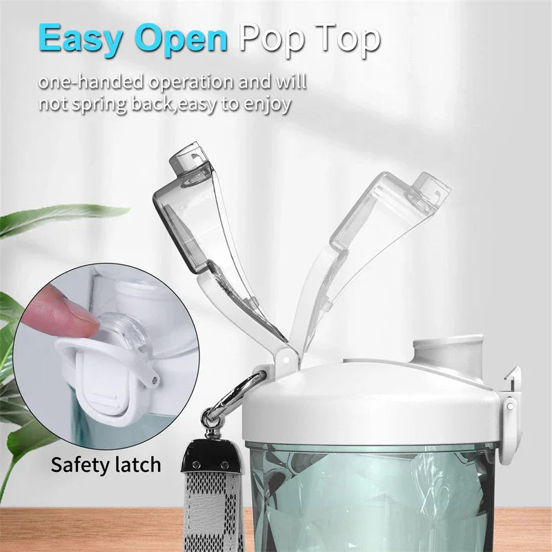 Clear plastic water bottle with easy-open pop top lid and safety latch, shown on tabletop.