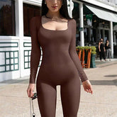 Woman wearing a brown ribbed long sleeve jumpsuit with a square neckline, slim fit