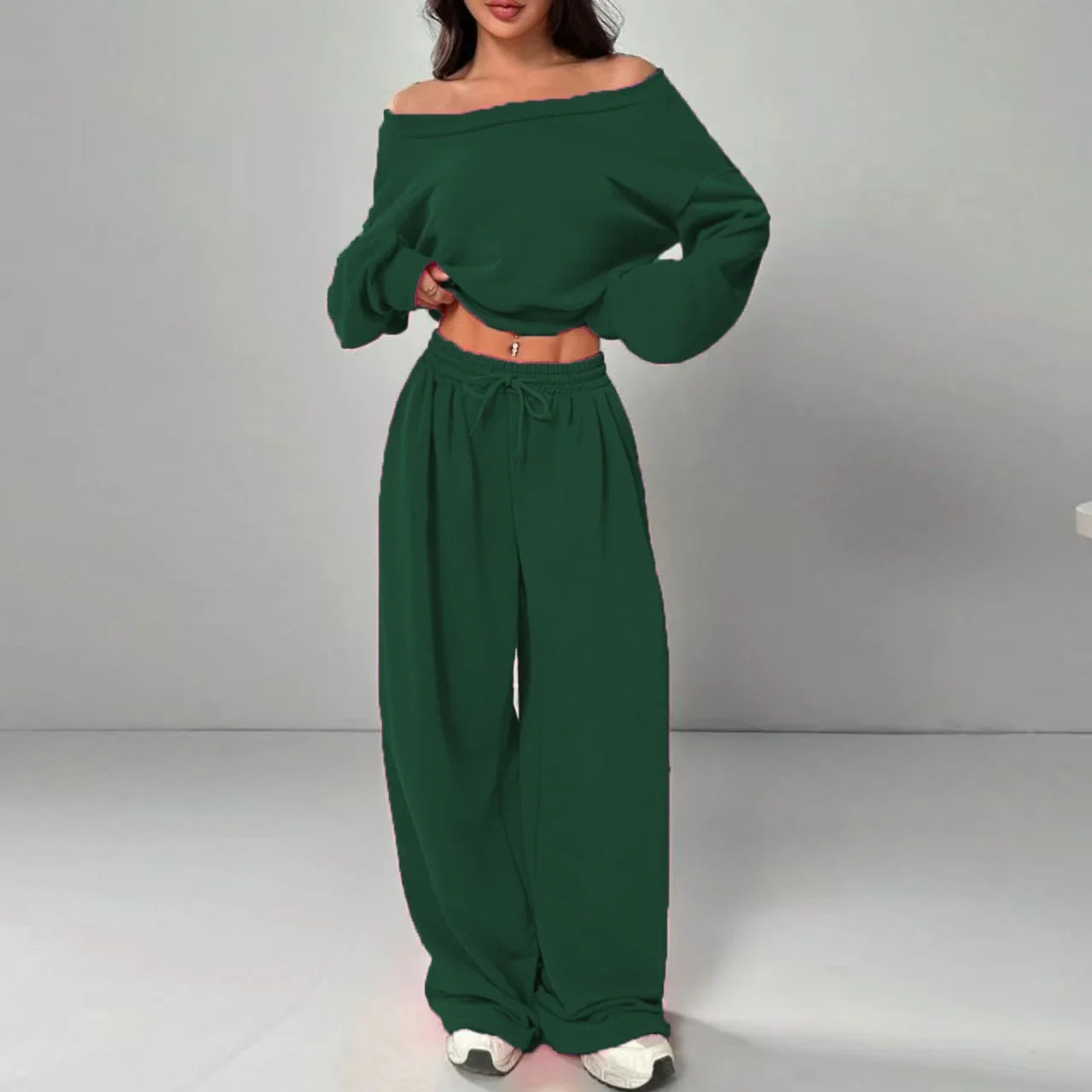 Woman wearing dark green off-shoulder long sleeve top and wide-leg sweatpants set, relaxed fit