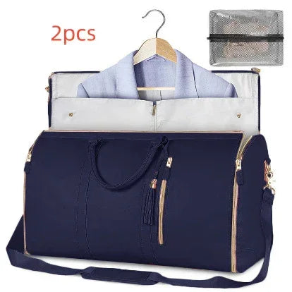 Navy blue duffel garment bag with gold zippers, hanger slot, and matching accessory pouch