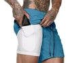 Blue drawstring shorts over white compression liner, athletic fit, lightweight fabric, streetwear style