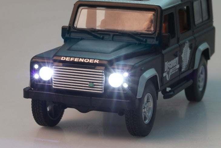 Black toy SUV with silver grille and LED headlights, glossy finish, modern design