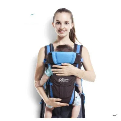 Woman wearing a sleeveless top carrying a baby in a blue and black soft fabric front carrier.