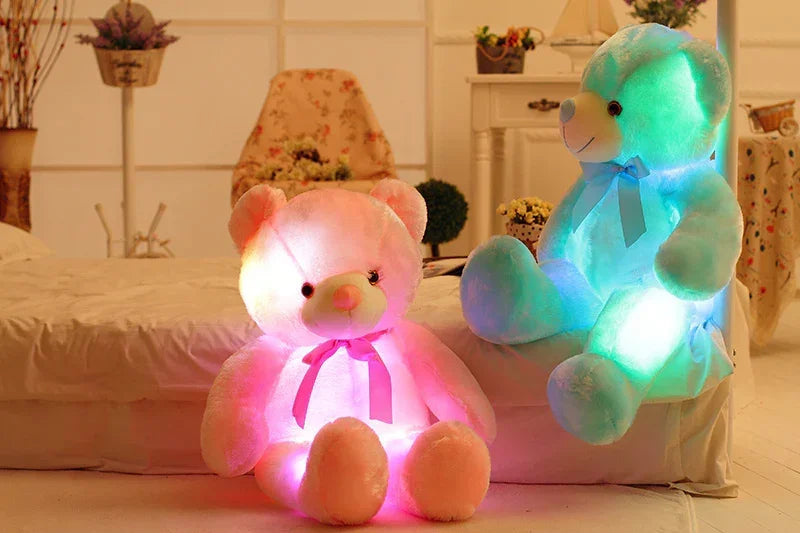 Fluffy plush teddy bears in pink and blue with glowing LED lights and satin bows