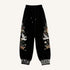 Black streetwear jogger pants with floral, butterfly, and crane embroidery, relaxed fit