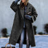 Oversized dark gray wool coat, relaxed fit, paired with casual ripped jeans.