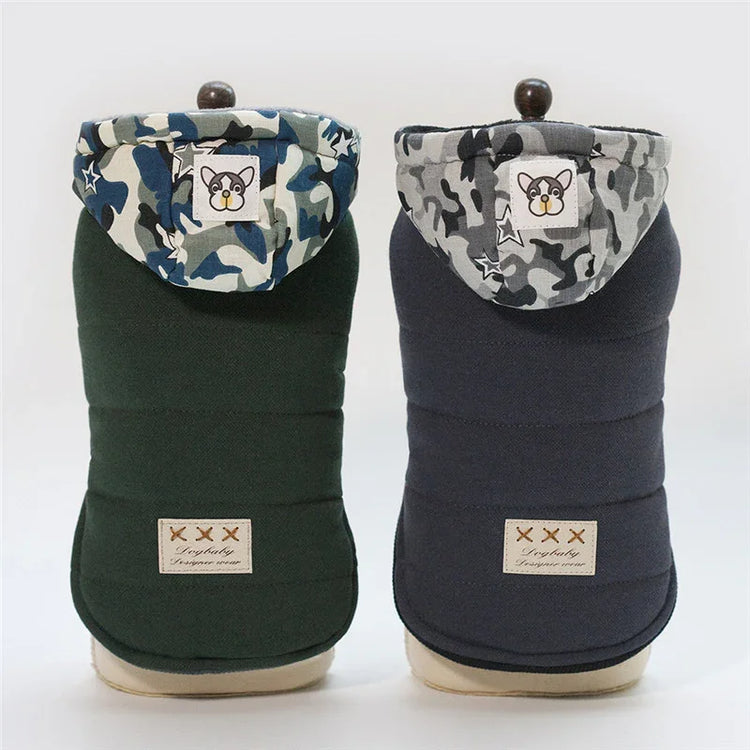 Two thick dog hoodies in green and navy, camo hoods with cartoon patch, quilted fabric, relaxed fit.