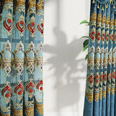 Luxurious blue and gold velvet curtains with intricate embroidered floral patterns, modern fit